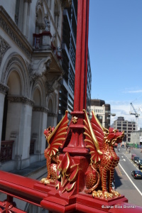 Dragon on Holborn Viaduct in the City of London with Goldman Sachs